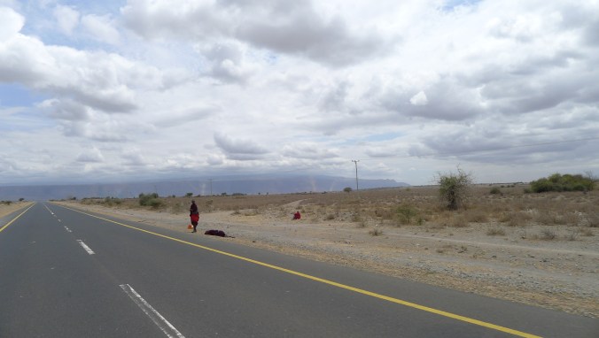 Masaai herdsmen walking by the side of the road... a very common sight in north west Tanzania