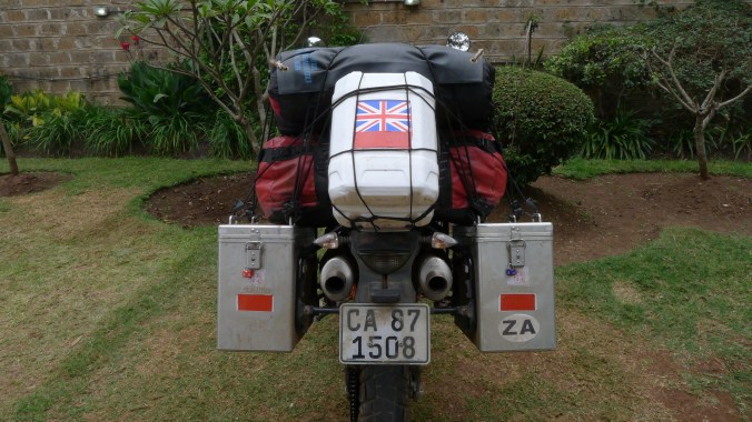 A twenty liter battery acid drum on the back of my KTM for more fuel. Just above the Akropovik exhausts that occasionally spit blue flames. Very healthy no safety.