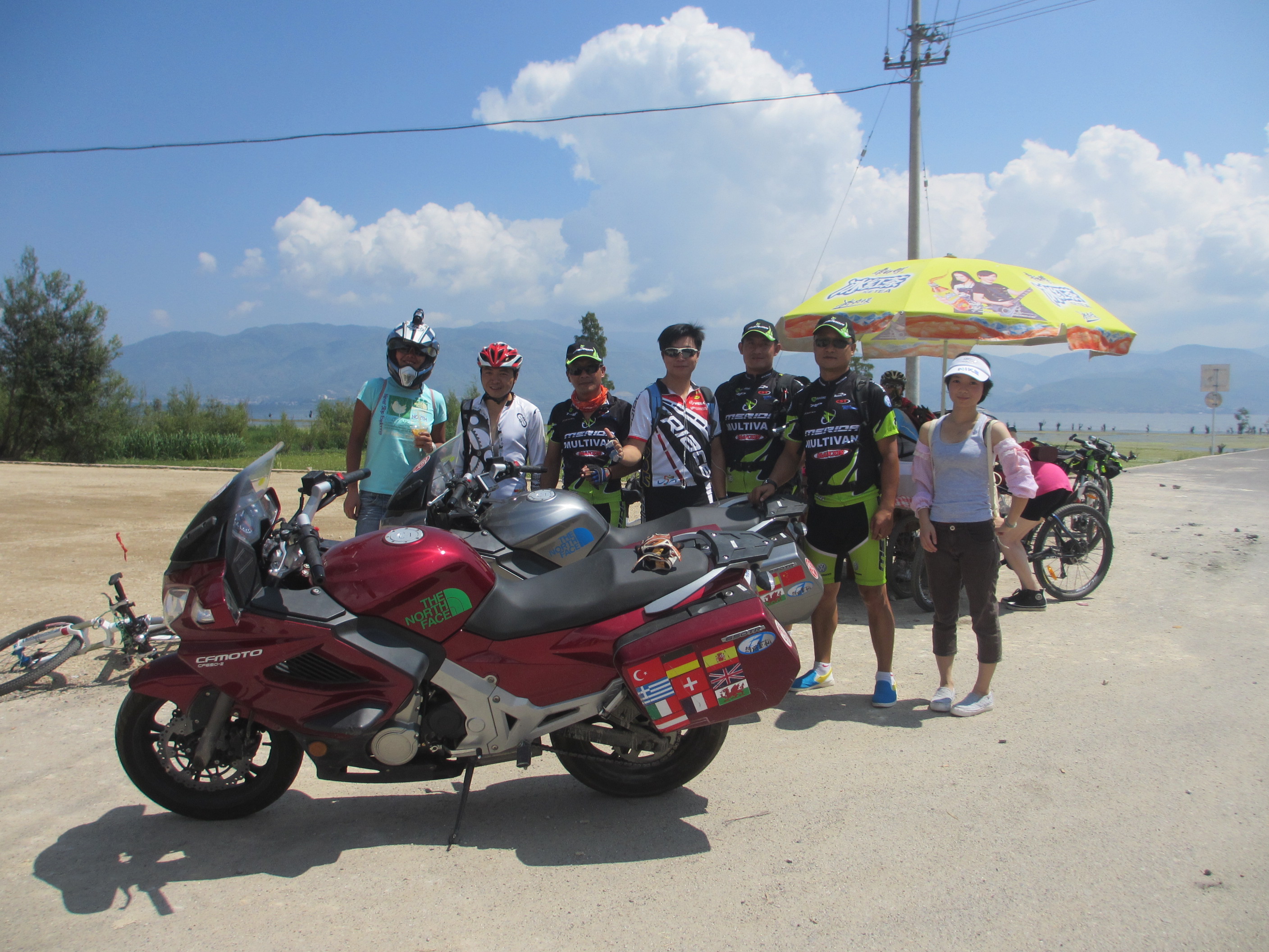 Cyclists riding around Dali lake, Yunnan