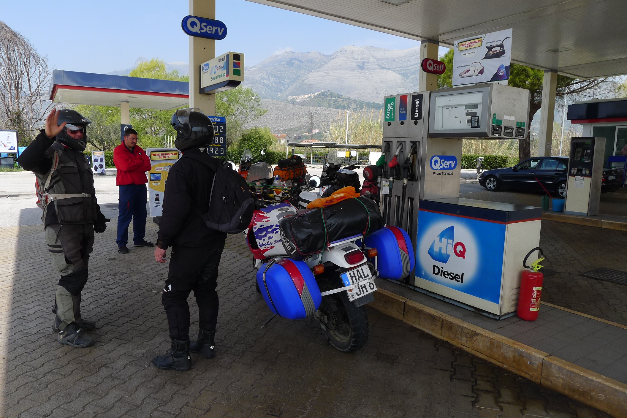 With an Africa Twin RTW rider in Italy ... met a petrol station as you do