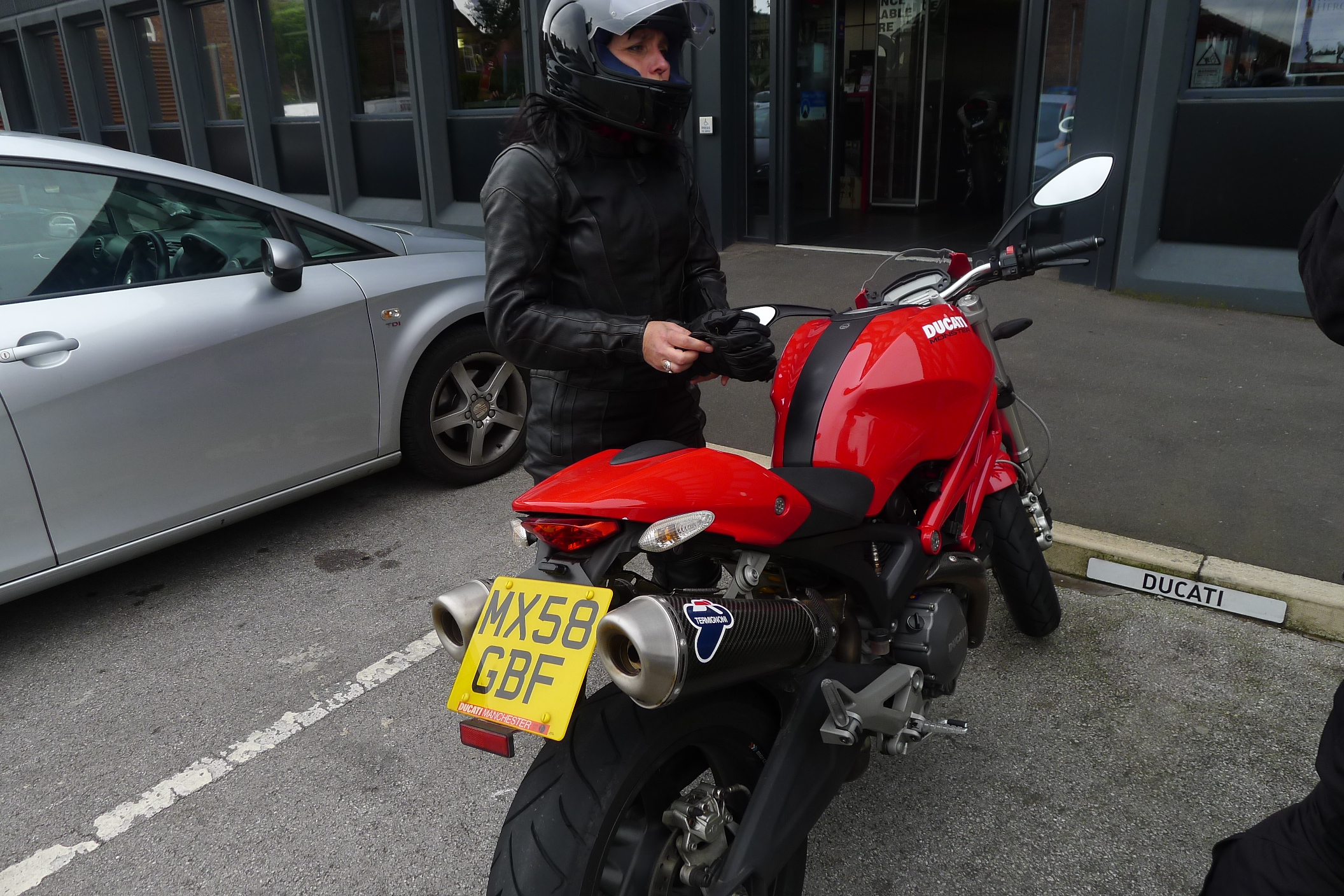 Andrea in riding kit ... and her Ducati