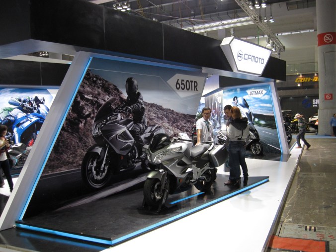 Chen Lei from CF Moto showing off their bikes