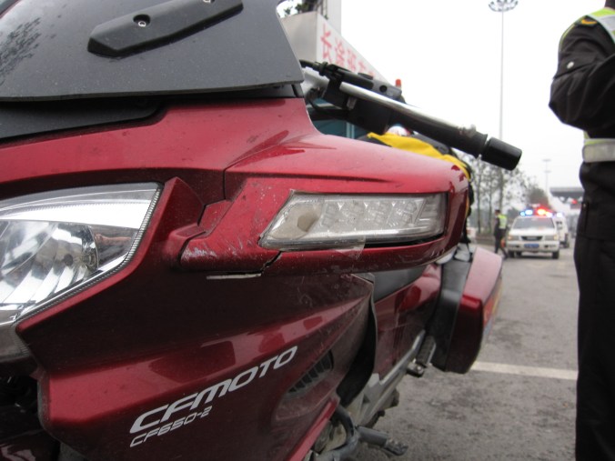 Bike fairing, mirrors, handlebars and crash bars damaged... but could have been worse. 