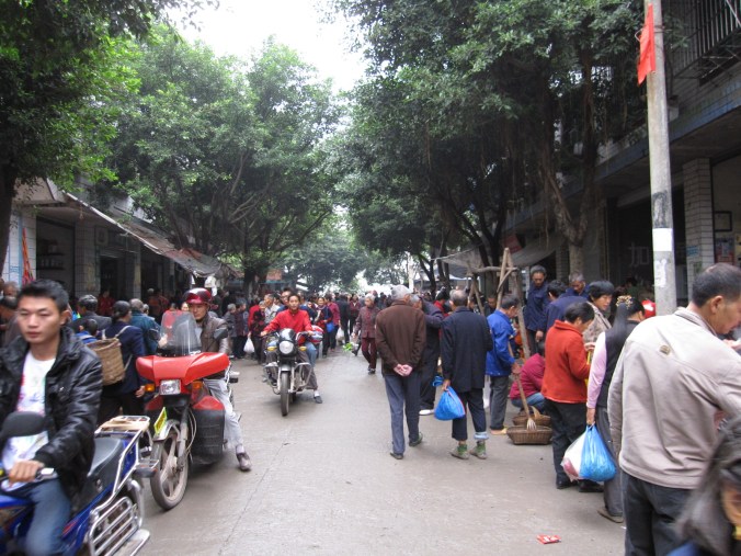 One of many small and crowded towns we rode through in Chongqing