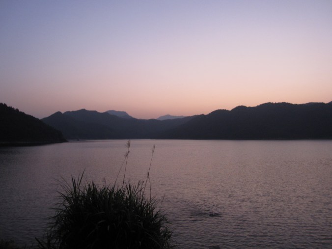 Swimming in Huating lake as the sun sets