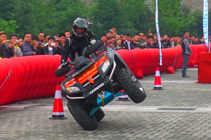 Hu Hai on the ATV doing ... what do you call it? ... a sidey? 